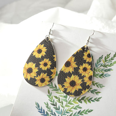 Faux leather dangle earrings, sunflower with black background