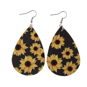 Faux leather dangle earrings, sunflower with black background