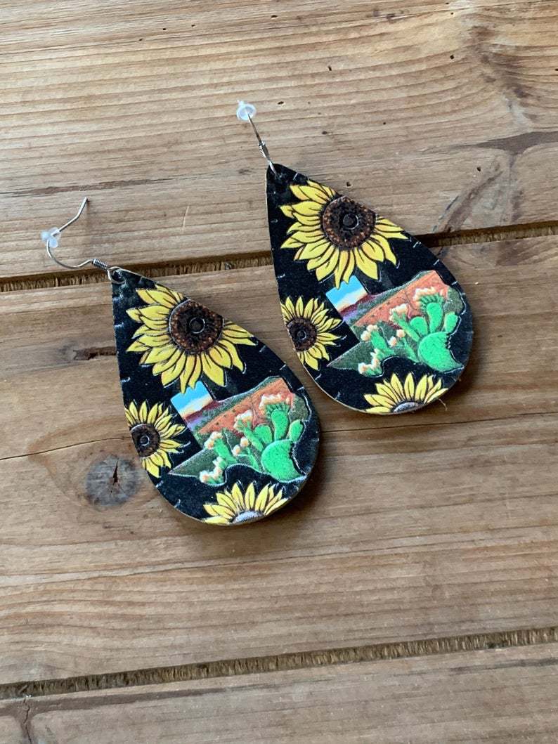 Faux leather dangle earrings, sunflower with Texas shape, black background
