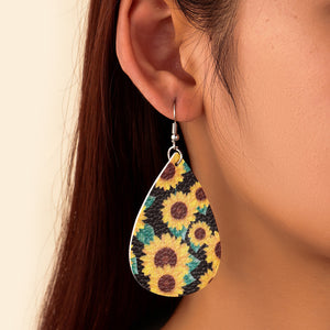 Faux leather dangle earrings, sunflower with green leaves
