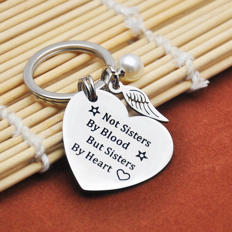 Sisters by heart keychain